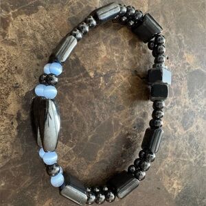 Magnetic hematite beaded bracelet featuring blue accents.